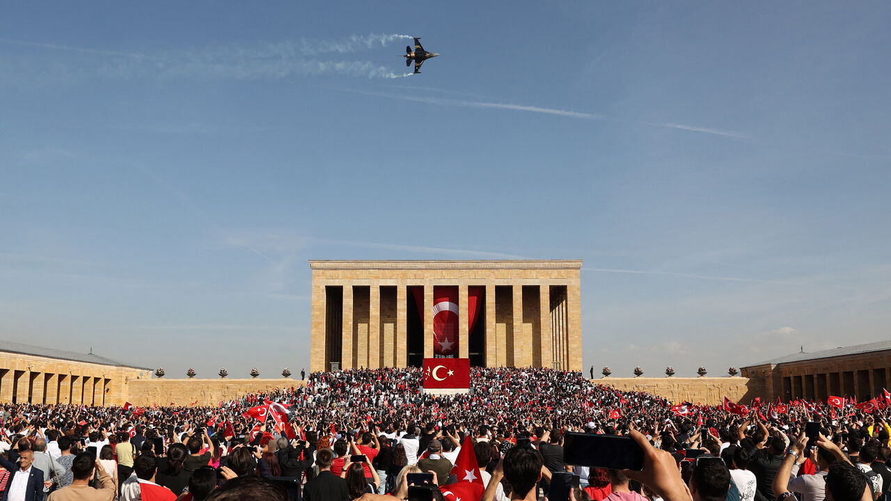 The Soloturk aerobatic demonstration team of the Turkish Air Force flies an F-16 aircraft over Anitkabir, the mausoleum of Turkish Republic's Founder Mustafa Kemal Ataturk, during celebrations to mark the 100th anniversary of the Republic of Turkey in Ankara, on October 29, 2023. Turkey marked its centenary as a post-Ottoman republic on October 29, 2023, with somewhat muted celebrations held in the shadow of Israel's escalating war with Hamas militants in Gaza. (Photo by Adem ALTAN / AFP) (Photo by ADEM ALT